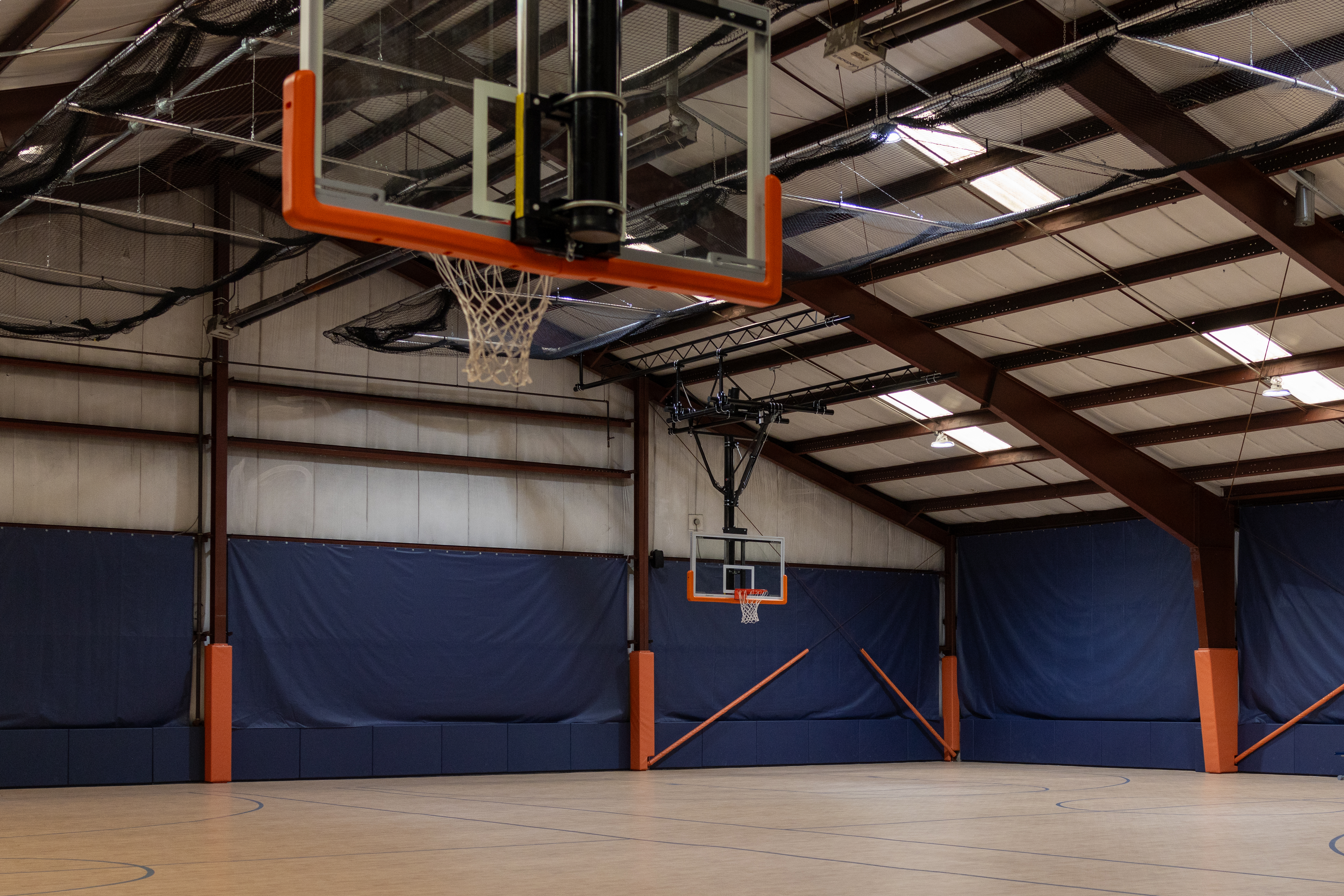 basketball court with two basketball hoops